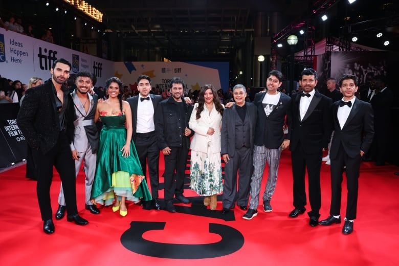 Indian movie stars dressed formally on the film festival red carpet