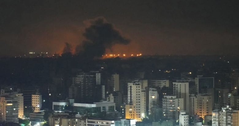 Smoke rises after an Israeli airstrike targeted a neighbourhood in Beirut's southern suburbs in the early hours of Saturday, Oct. 5, 2024.