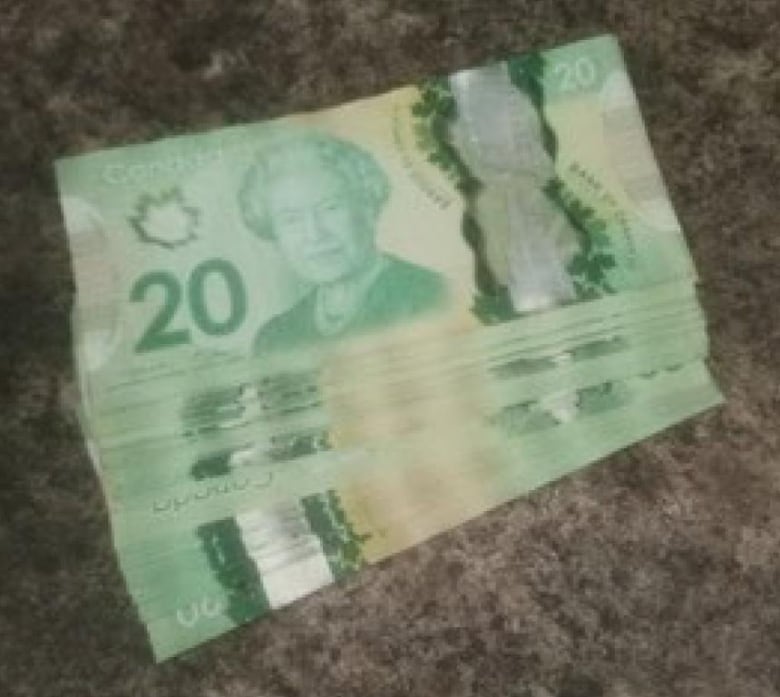 A stack of green Canadian $20 bills