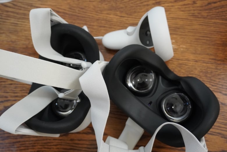 White headsets on a table.