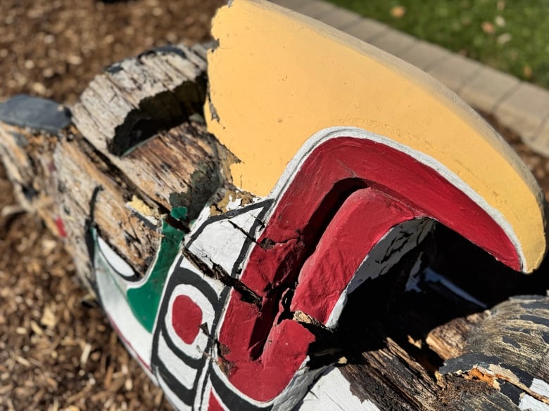 Close-up of a carved totem pole.