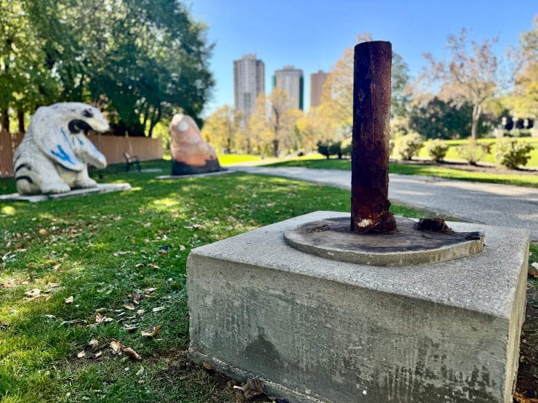 A metal pole where the totem pole used to be.