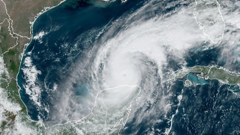 A satellite photo shows a swirling hurricane in the Gulf of Mexico.