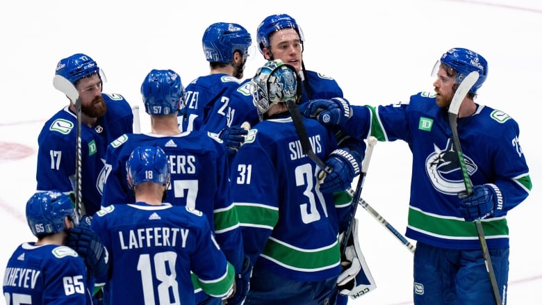 Hockey players on ice.