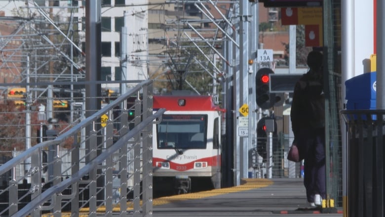 an LRT train approaches a station outside