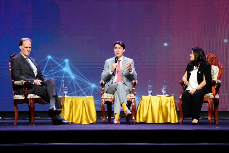 Prime Minister Justin Trudeau, centre, participates in an armchair discussion with Minister of Export Promotion, International Trade and Economic Development, Mary Ng, right, and Ambassador of Canada to Japan, Ian G. McKay at the ASEAN business and investment summit, Friday, Oct.11, 2024 in Vientiane, Laos.