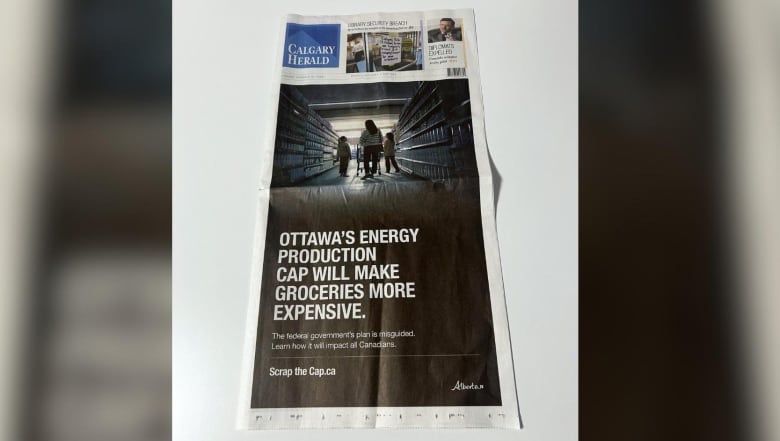 Front page of the Calgary Herald newspaper, with a full-page ad.