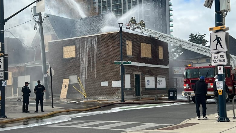 Fire crews are again tackling a suspicious fire that broke out at 737 Dundas Street Wednesday morning. A fire occurred in the same location in September. 