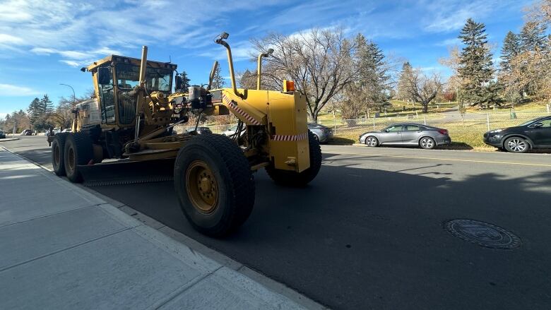 A large yellow snow plow.