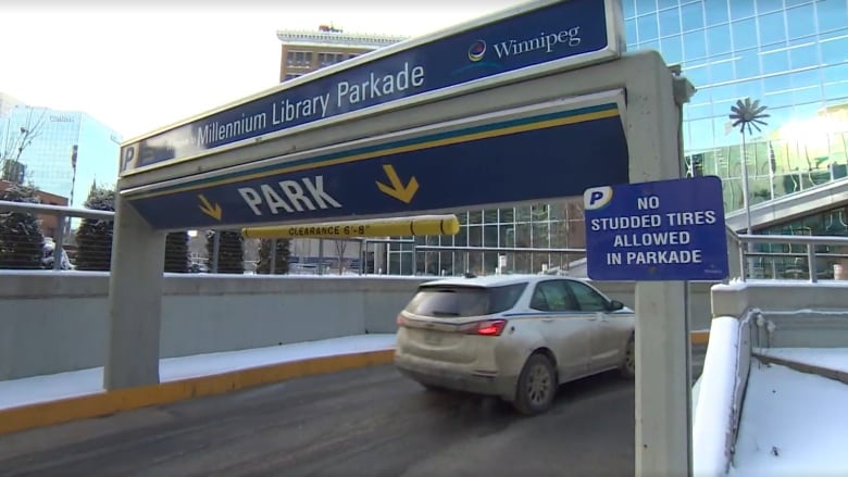 A car drives into an underground parkade