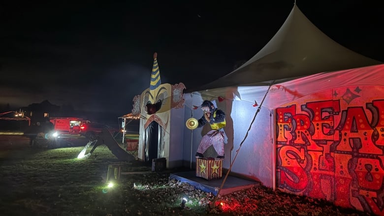 A tent with red lights and the word 