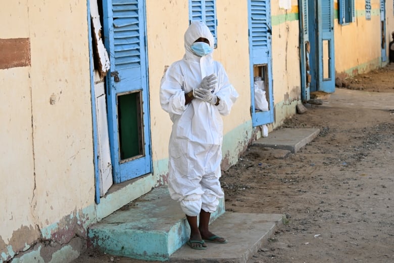 A health worker wears a protective outfit at a hospital where cholera patients are treated in Sudan's Red Sea State.