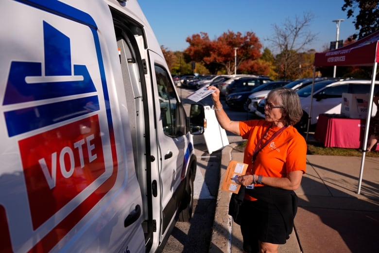 Woman drops off ballot in van that says 