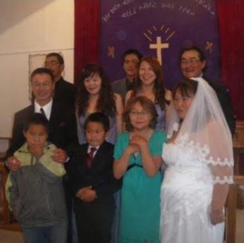 family poses for photo at church