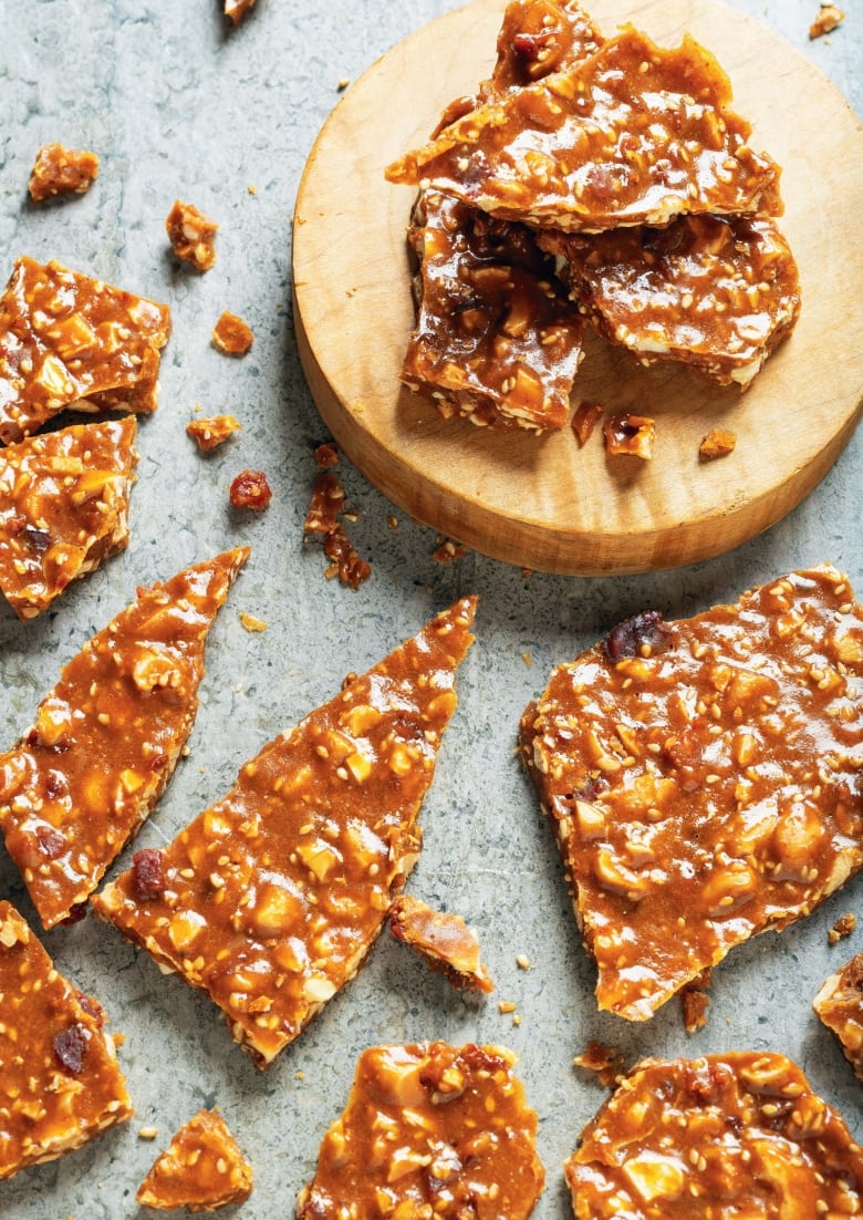 cashew brittle is pictured on a grey table