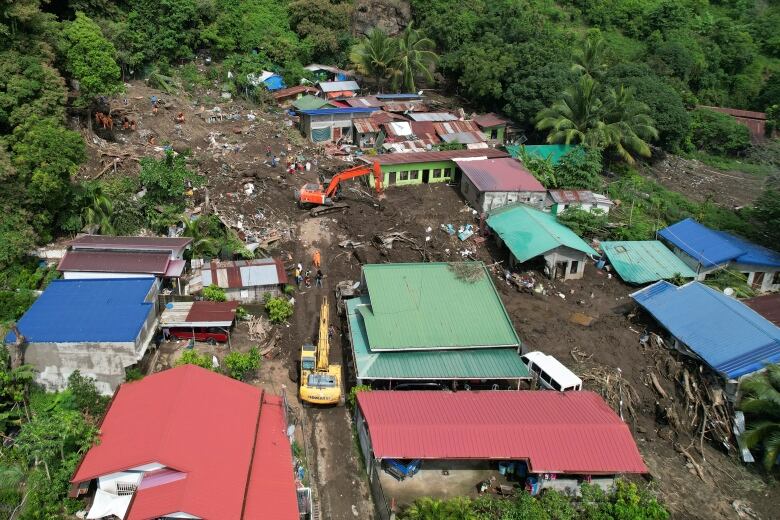 An aerial view of homes buried in a landslide.