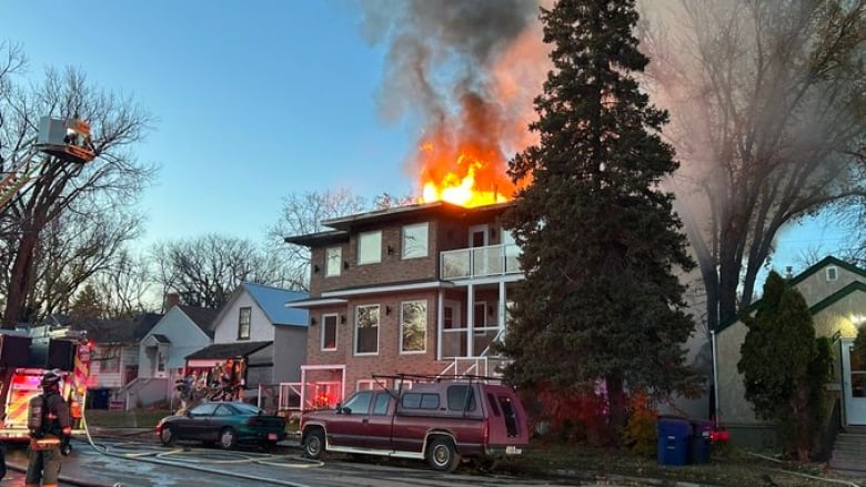 A house with flames on the roof.