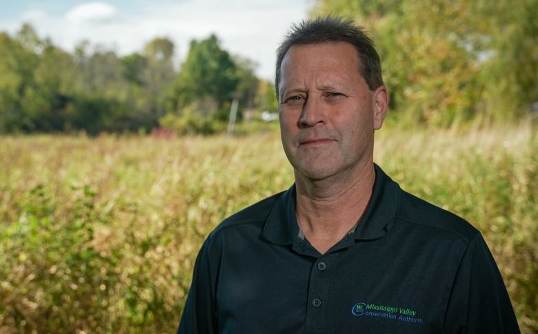 A photo of Matt Craig, manager of planning and regulations at the Mississippi Valley Conservation Authority, with wetlands in the background.