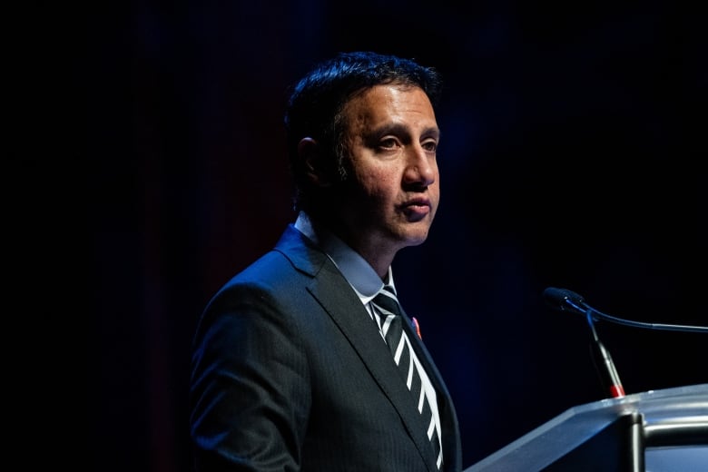 man at speaking podium