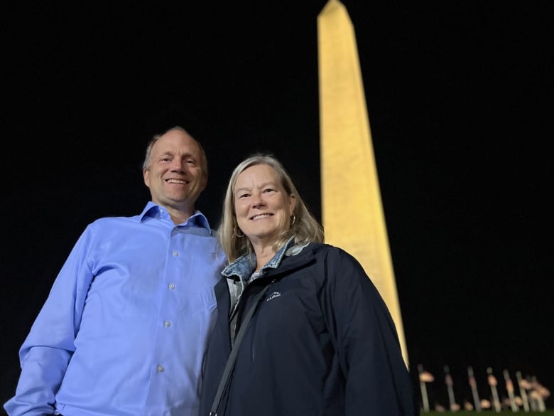 Husband and wife in front of Washington Monument