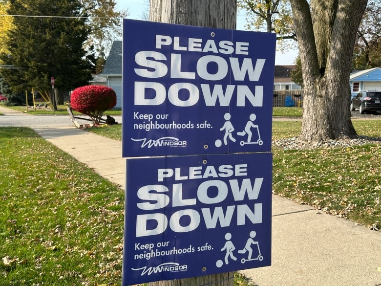 A sign asking drivers to slow down.