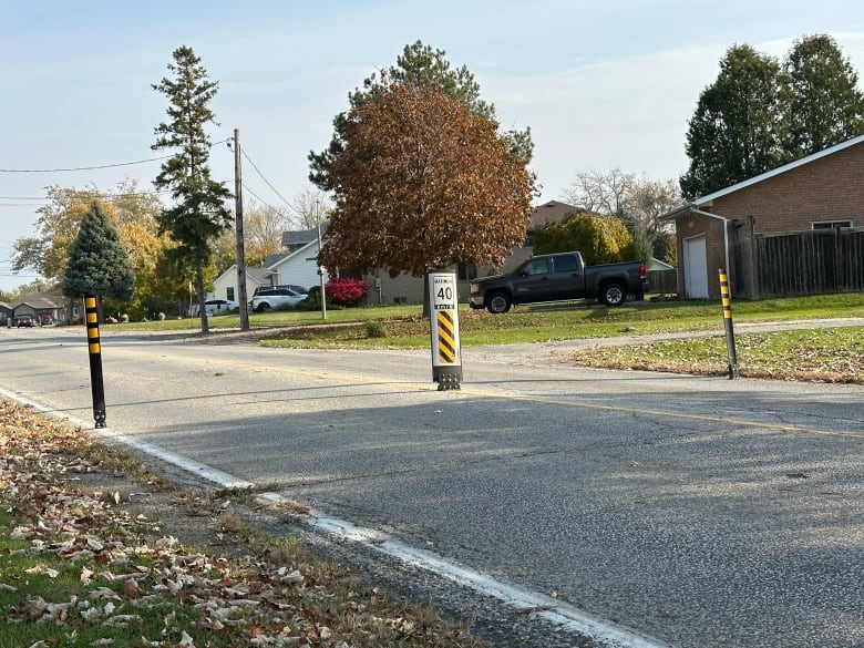 A traffic bollard in a residential neighbourhood.