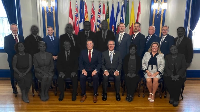 Premier Scott Moe's cabinet seated at Government House in 2023. In all 10 of 17 ministers from 2023 are greyed out in the photo.