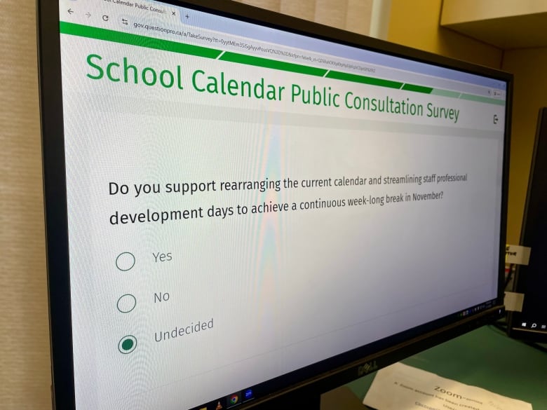 A computer screen reading 'PEI school calendar public consultation survey.'