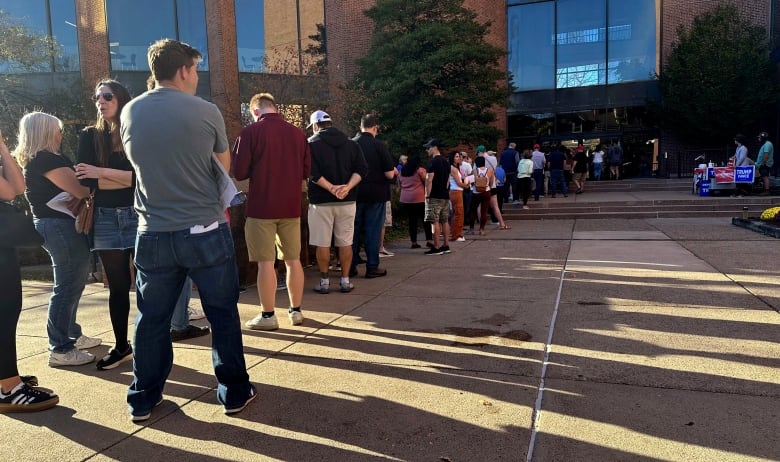 Voters line up outside the Bucks County Administration Building in Doylestown, Pa., during a period of early voting in the general U.S. election.