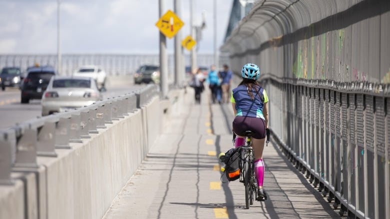 A cyclist on the bike path. 