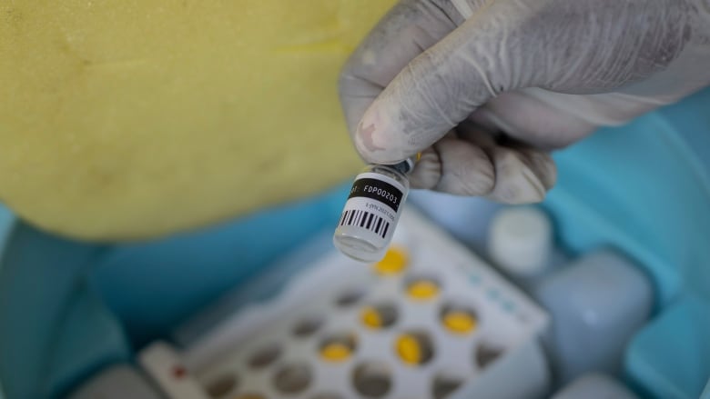 A nurse holds a bottle of mpox vaccine at the General hospital, in Goma, Democratic Republic of Congo in October 2024.