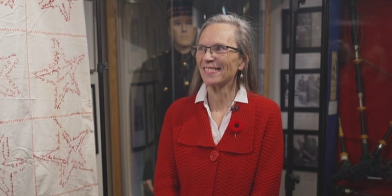 A smiling woman wearing red