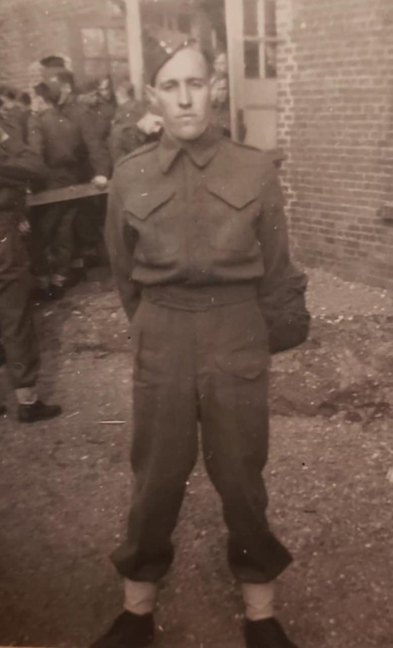 A sepia-tone photo of a young private in a 1940's military uniform.