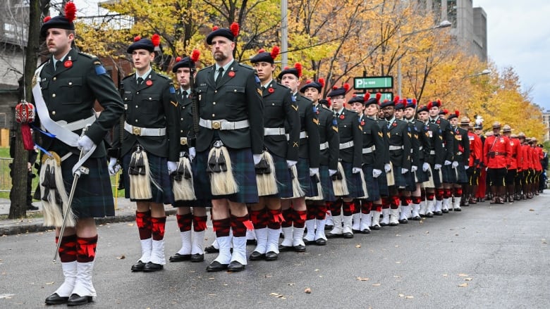 People marching during a ceremony.