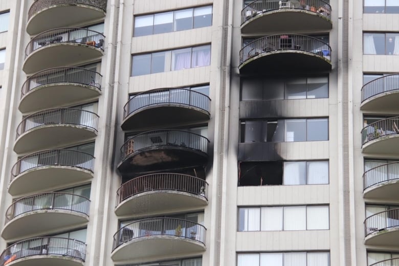 Units in an apartment building show visible signs of smoke damage.