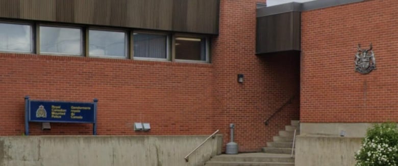 The exterior of a brick building, with the RCMP logo and wordmark visible.