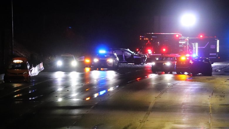 Five cars on a dark highway