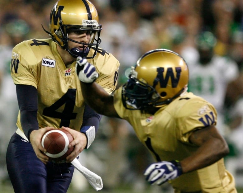 A handoff from quarterback to running back during the CFL's championship game.