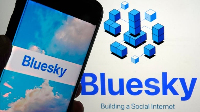 The Bluesky social media app is shown on a mobile phone and a laptop.