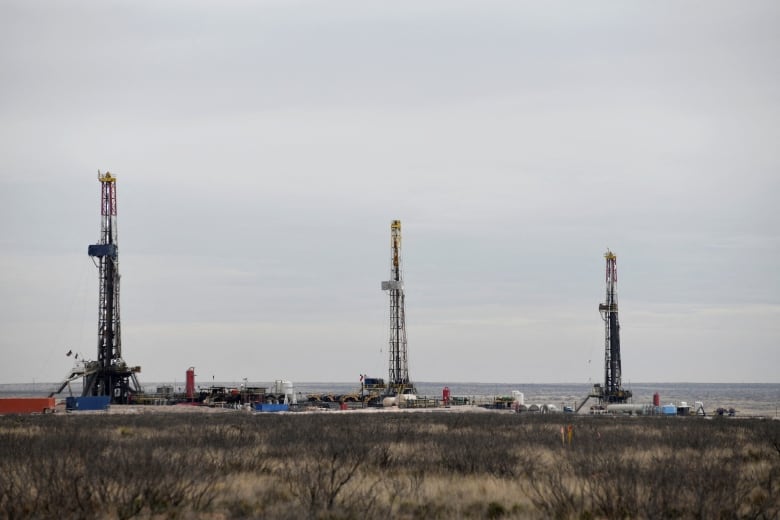 Drilling rigs operate in the Permian Basin oil and natural gas production area in New Mexico. Donald Trump wants to increase oil and gas production in the U.S.