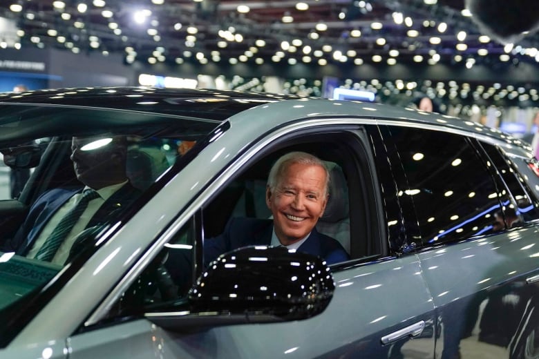 President Joe Biden drives a Cadillac Lyriq during a tour at the Detroit Auto Show in 2022. His administration has pushed regulations that will promote electric vehicles through rules on automobile emissions. 