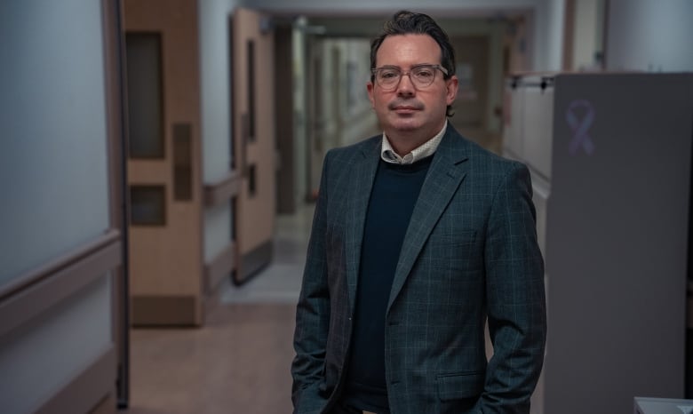 photo of Dr. David Laidley in a hospital corridor