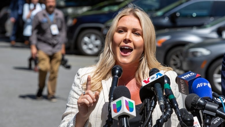 Karoline Leavitt speaks to members of the media in New York in May 2024.