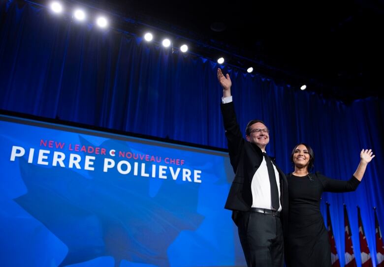 Conservative Party of Canada Leader Pierre Poilievre and his wife Anaida wave on stage after he was announced as the winner of the Conservative Party of Canada leadership vote, in Ottawa, on Saturday, Sept. 10, 2022.