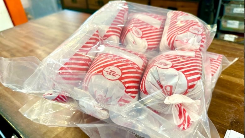 Red and white packs of ground beef are sold together in a clear bulk bag.