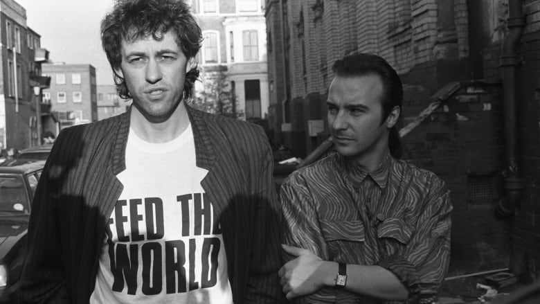 Bob Geldof and Midge Ure pictured outside SARM Studios in Notting Hill, London, during the recording of the Band Aid single 'Do They Know It's Christmas?', part of the Feed The World campaign, raising money for famine-stricken Ethiopia, on November 25, 1984.