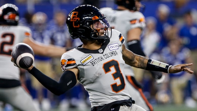 a football player prepares to throw the ball 