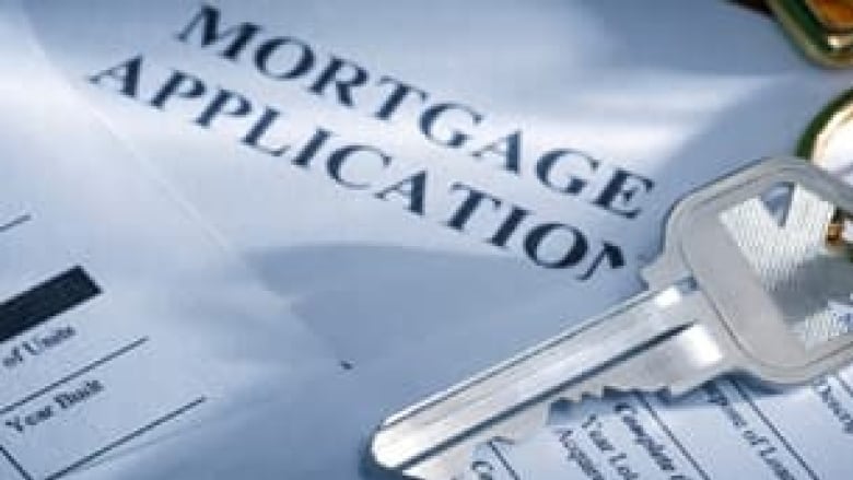 A mortgage application and a key.